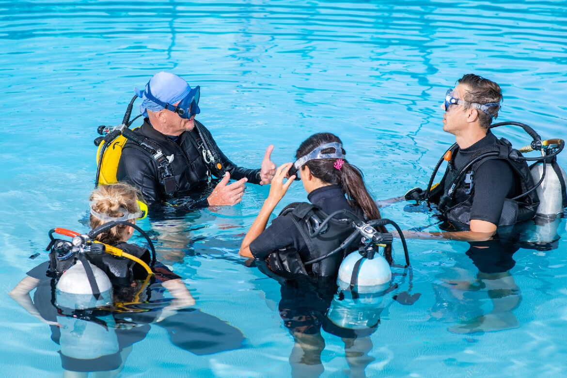 A scuba diver swimming in the clear waters of Saranda, Albania during their Padi instructor Course